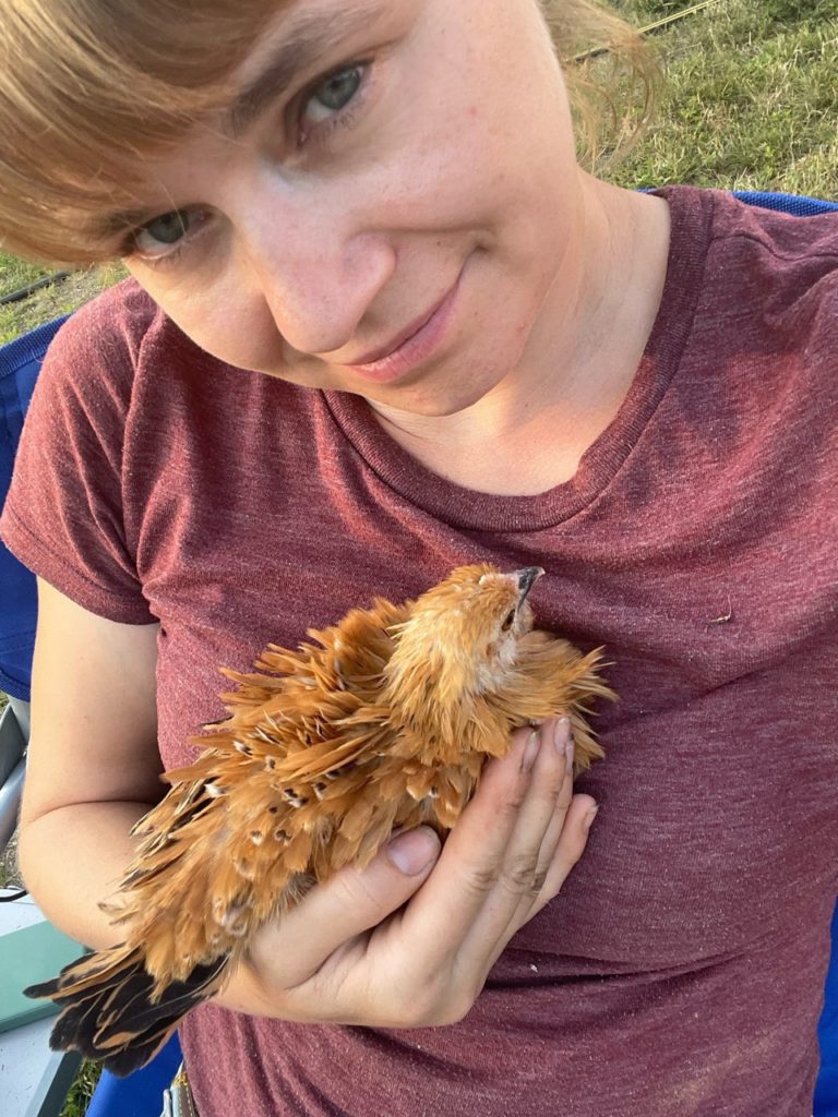 mandy wheaton holding a frizzle d'uccle booted bantam 